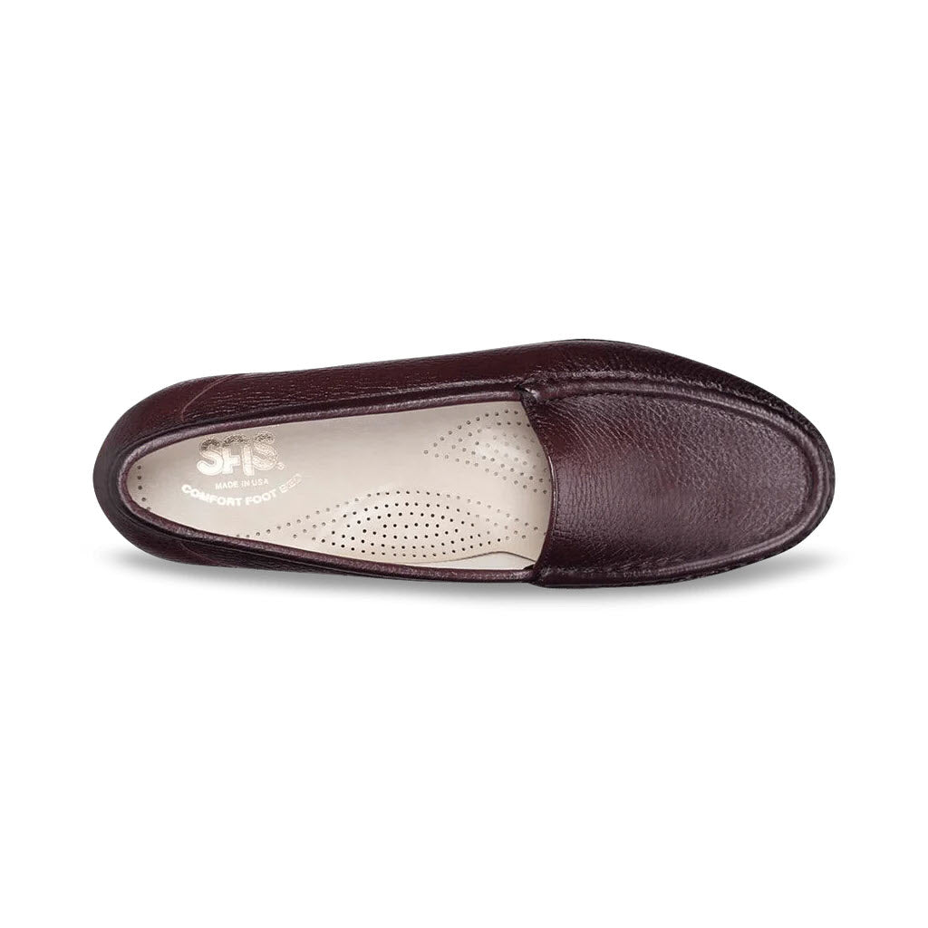 A single brown leather slipper with a removable cushioned footbed labeled &quot;comfort foot&quot; SAS SIMPLIFY ANTIQUE WINE - WOMENS.