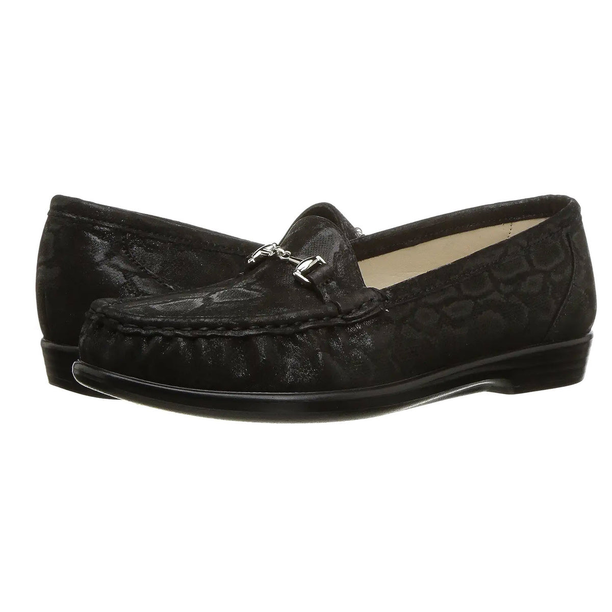 A pair of black leather SAS Metro Nero Snake slip-on loafers with a metallic ornament on the front, displayed against a white background.