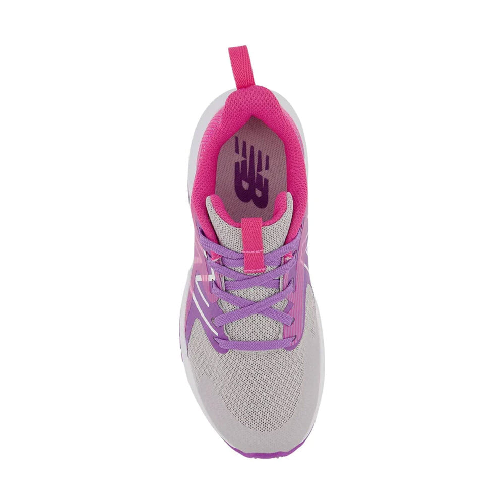 Top view of a single gray and pink New Balance Kids athletic shoe with laces, from the New Balance Rave Run v2 collection designed for play-all-day support.