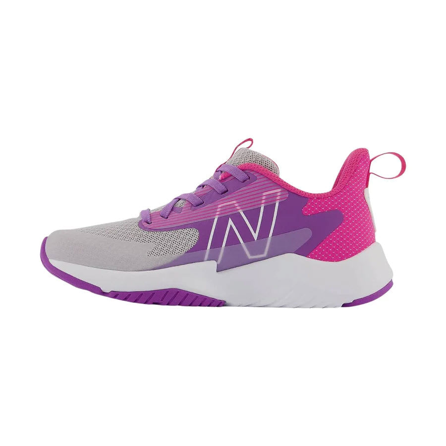 Side view of a gray and purple New Balance RAVE RUN v2 Summer Fog athletic shoe with white sole and branding detail, designed for play-all-day support.