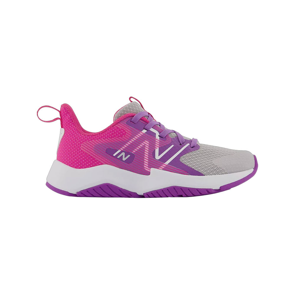 A single pink and grey New Balance Rave Run v2 sports sneaker with a white sole and the letter 'n' on the side, designed by New Balance Kids for play-all-day support.