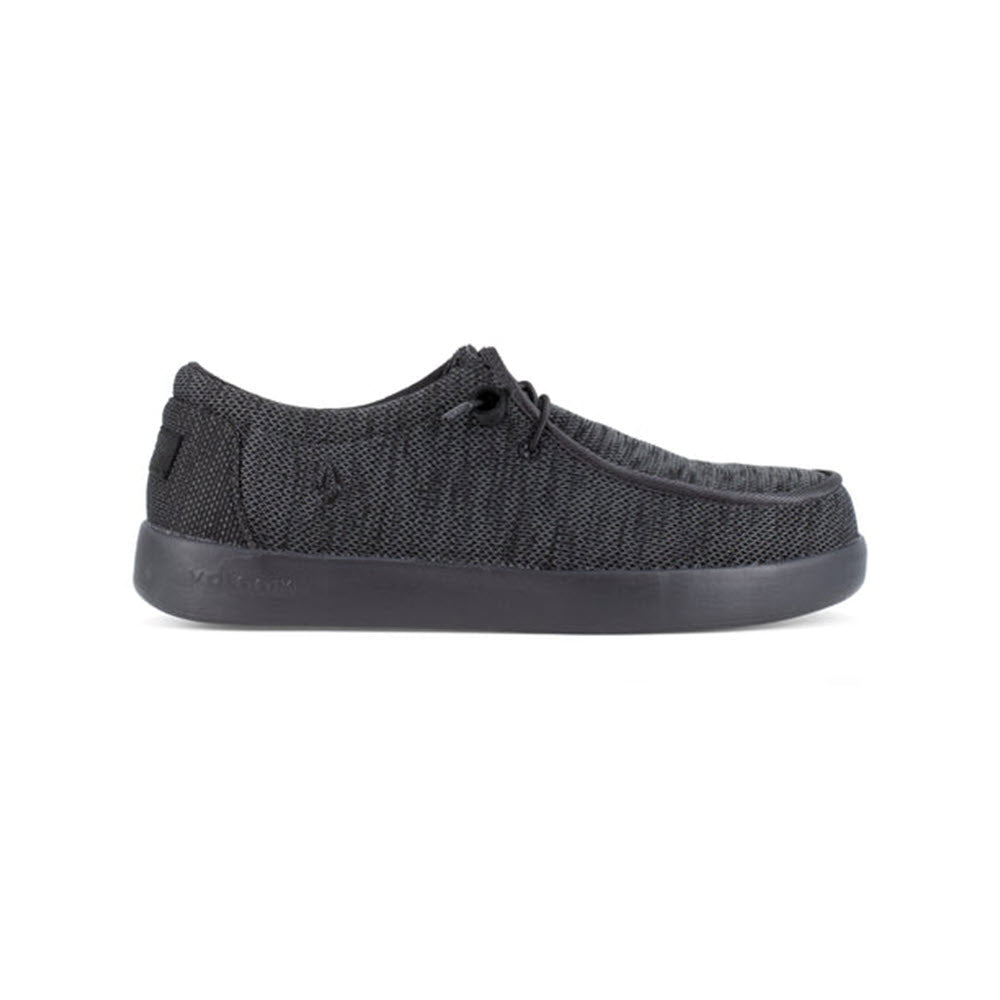 Black casual slip-on shoe with a textured upper and a solid black, slip-resistant sole, displayed against a white background. 
Product Name: Volcom Chill Composite Toe Slip On Work Shoe Black - Mens
Brand Name: Volcom