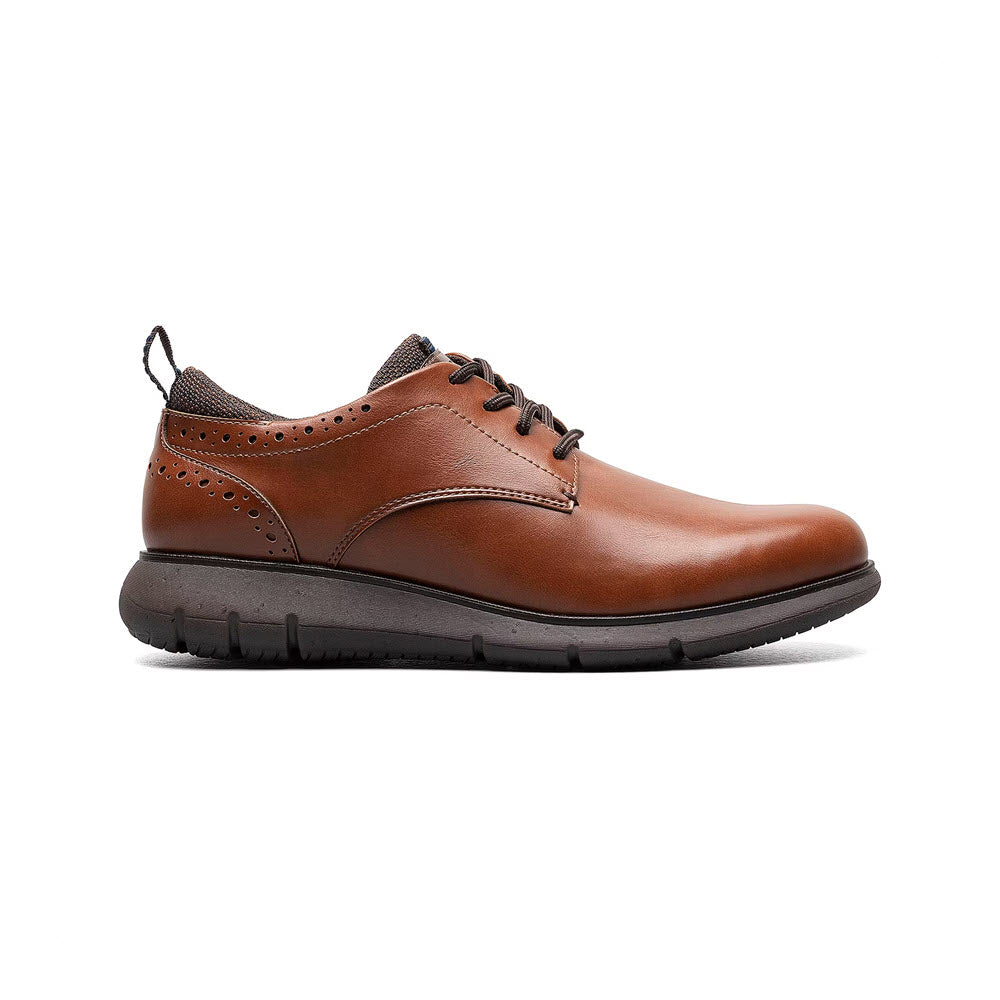 A single brown leather Nunn Bush Stance plain-toe oxford, featuring a low heel and perforated details, isolated against a white background.