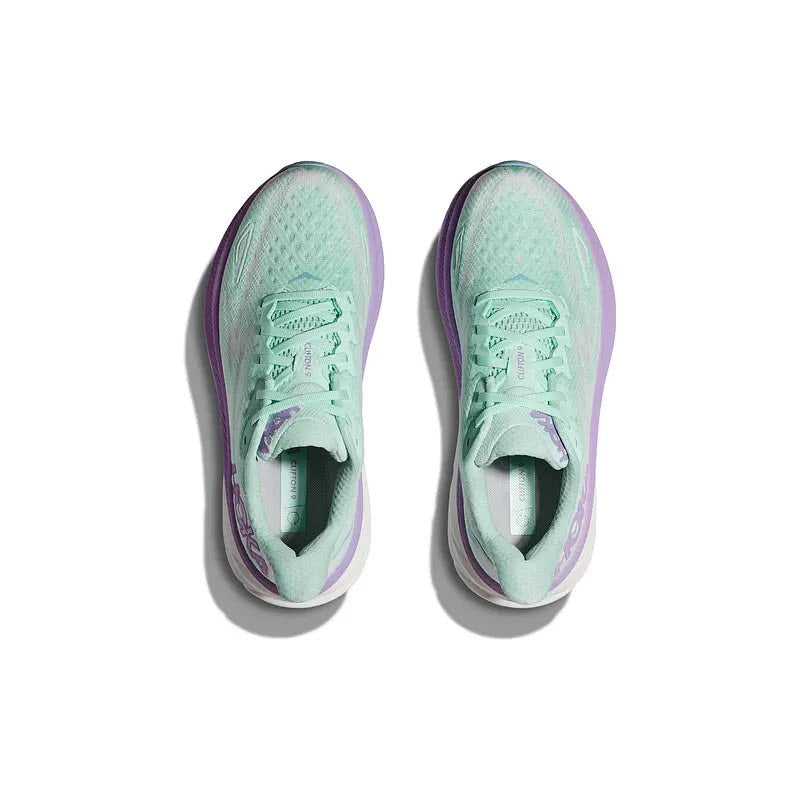 A pair of light green and purple Hoka Clifton 9 running shoes viewed from above on a white background.