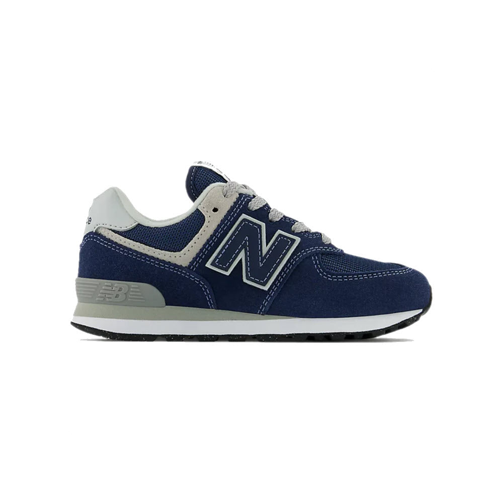 A single New Balance 574 Navy shoe, displayed against a white background.