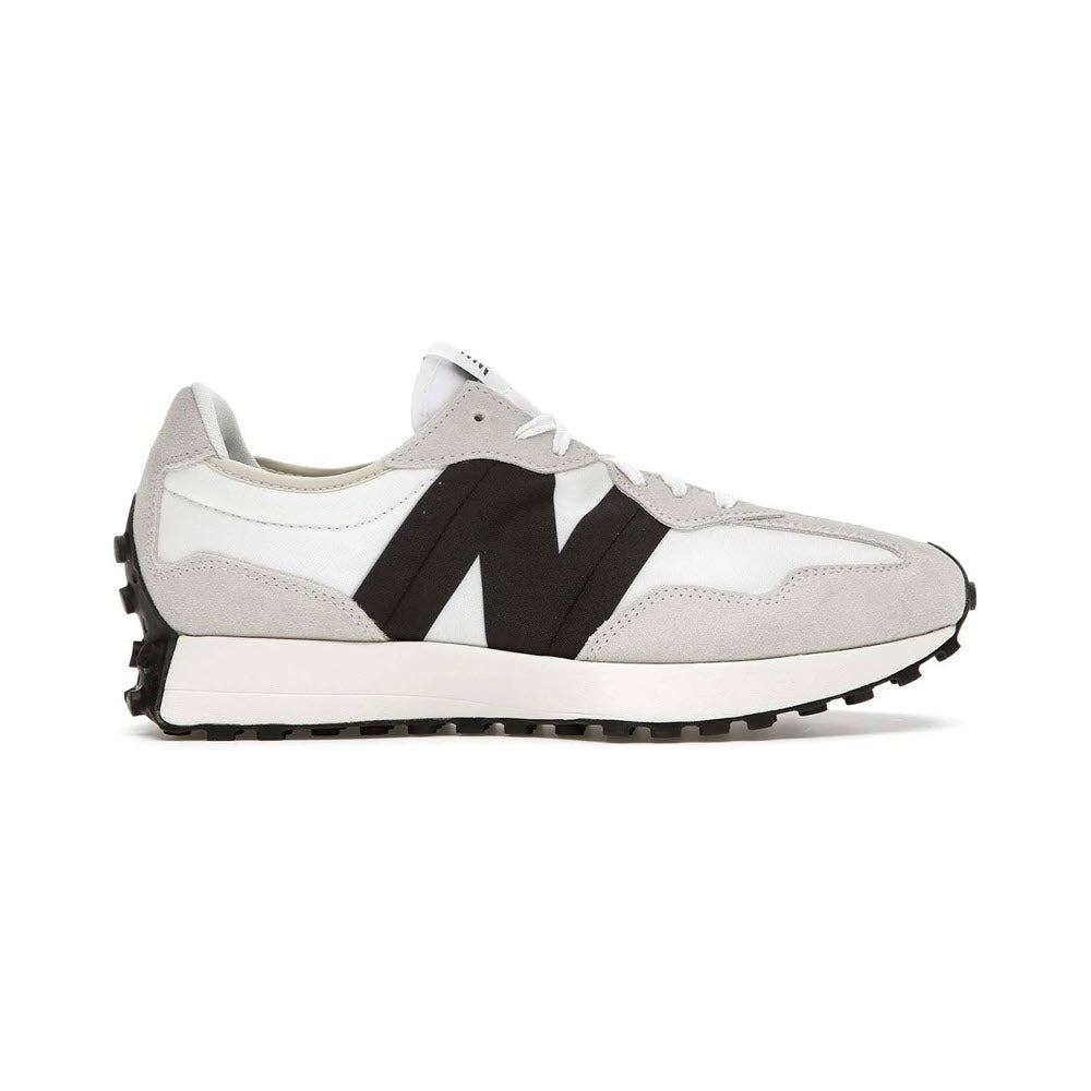 White and black New Balance 327 sneaker with a prominent n logo on the side, featuring a serrated rubber sole.