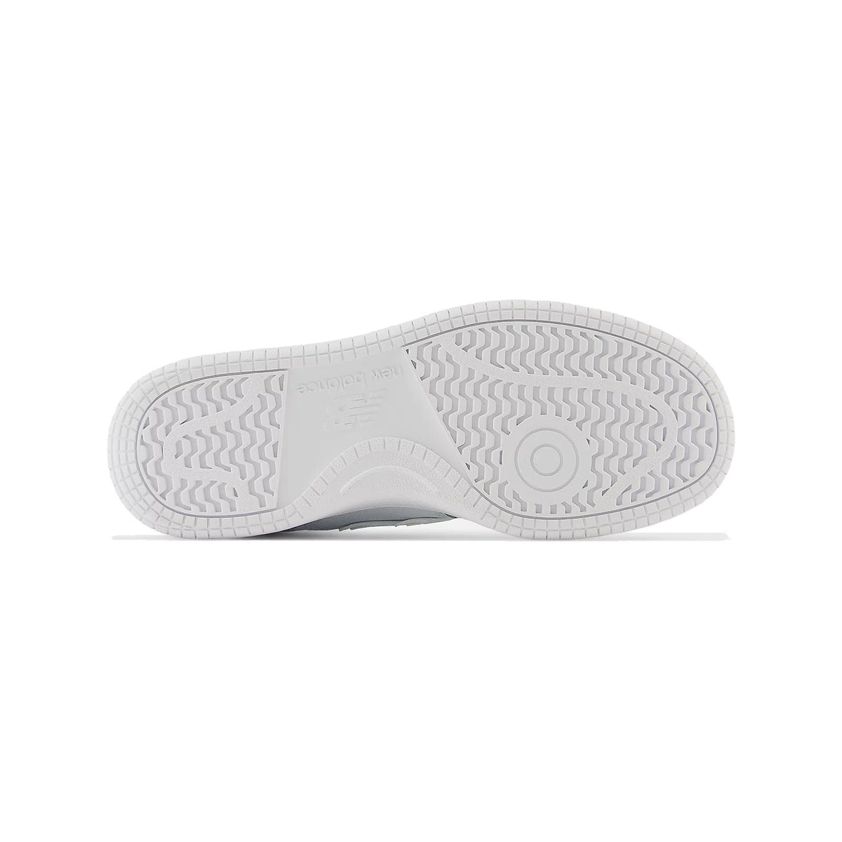 Bottom view of a New Balance Kids 480 White sneaker showing its textured sole with circular and wavy patterns.