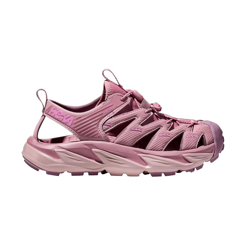 A single pink Hoka Hopara Foxglove/Pale Mauve trail running shoe placed against a white background, showing its side profile with visible Hoka logo and a sticky rubber outsole.