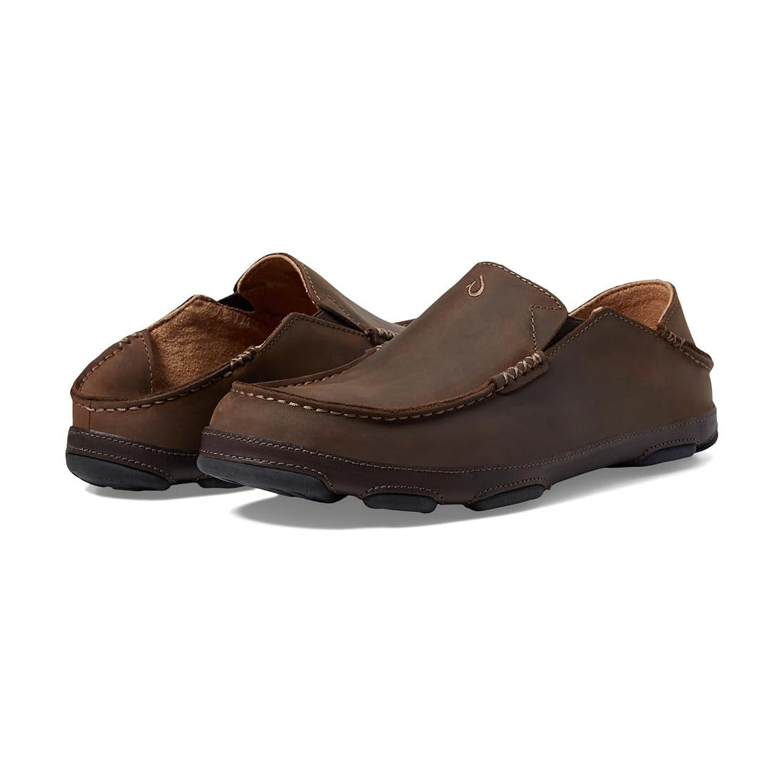 A pair of men&#39;s Olukai Moloa slip-on casual shoes crafted from water-resistant leather, presented against a white background.