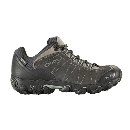 A single black OBOZ BRIDGER LOW WP DARK SHADOW - MENS waterproof hiker with the brand label &#39;Oboz&#39; displayed on the side showcases a BDry waterproof membrane.