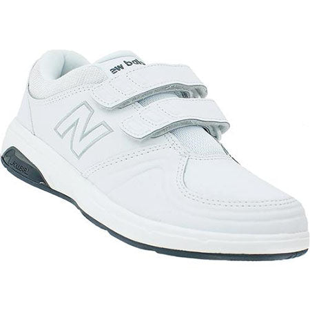 White New Balance WW813HWT walking shoe with velcro straps and a black sole, isolated on a white background.