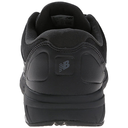 Rear view of a black New Balance MW813BK walking shoe showing the logo, arch support, and cushioned heel.