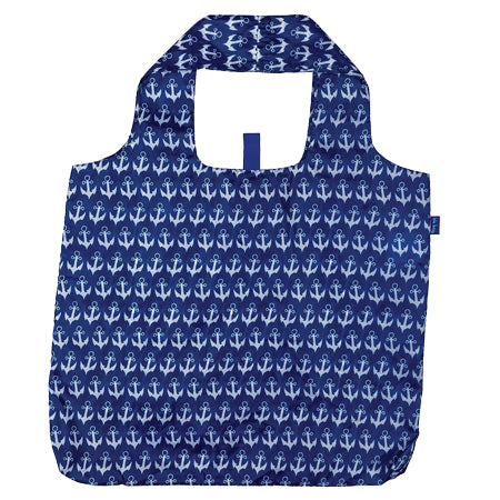 A reusable Rockflowerpaper BLU BAG ANCHOR NAVY with an all-over white anchor print, featuring eco-friendly built-in handles and a compact design.