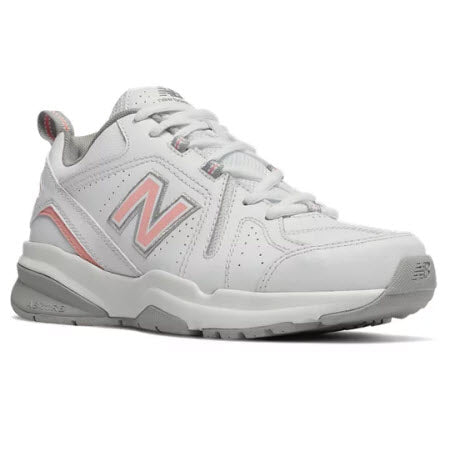 Side view of a white New Balance X608V5 sneaker with grey accents and a visible logo, designed with a thick sole and lace-up front.