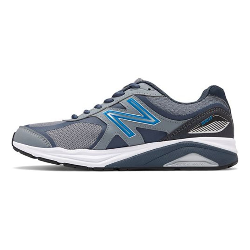A New Balance 1540v3 Marblehead/Black sneaker with a grey and blue color scheme and prominent logo on the side, set against a white background, designed for overpronation support.