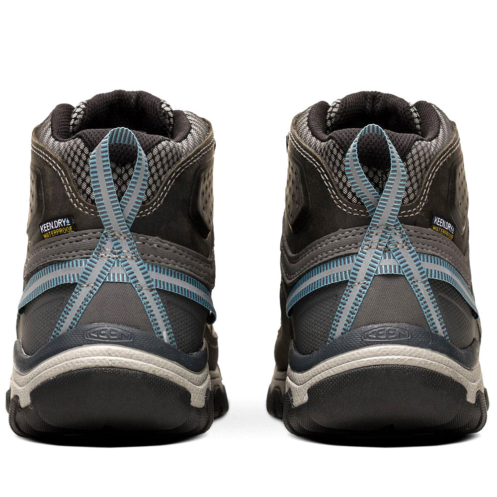 Rear view of a pair of Keen Targhee III Mid Waterproof Magnet/Atlantic Blue - Women&#39;s hiking boots showing the gray and blue design, brand logo, and crisscrossed laces.