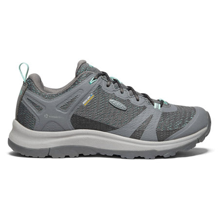 A steel gray Keen women's hiking shoe with ocean wave accents, multi-directional lugs, and a rubber sole, displayed against a white background.
