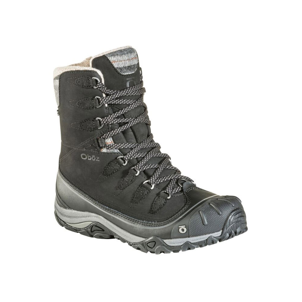 A single Oboz women&#39;s winter hiker boot in gray and black with rugged tread and lace-up front, isolated on a white background.
