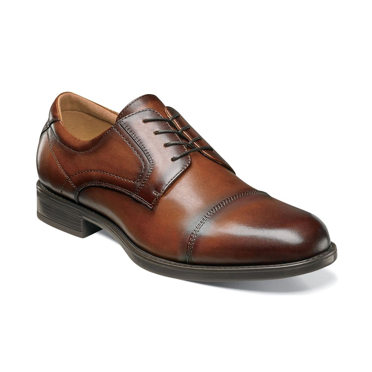 A polished brown leather dress shoe with laces, featuring detailed stitching and a low heel, known as the Florsheim Midtown Cap Toe Oxford.