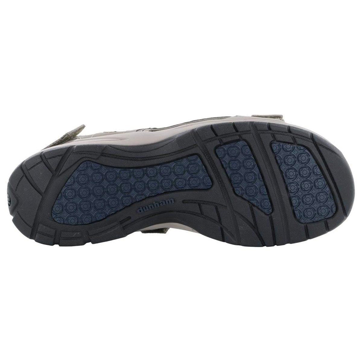 Bottom view of a Dunham sandal featuring a detailed tread pattern and a slip-resistant rubber outsole with Dunham labeling on the sole.