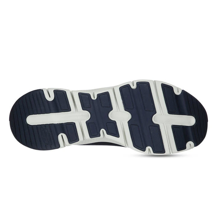 A close-up view of the tread pattern on the sole of a Skechers Arch Fit walking shoe, featuring a white and navy blue design.