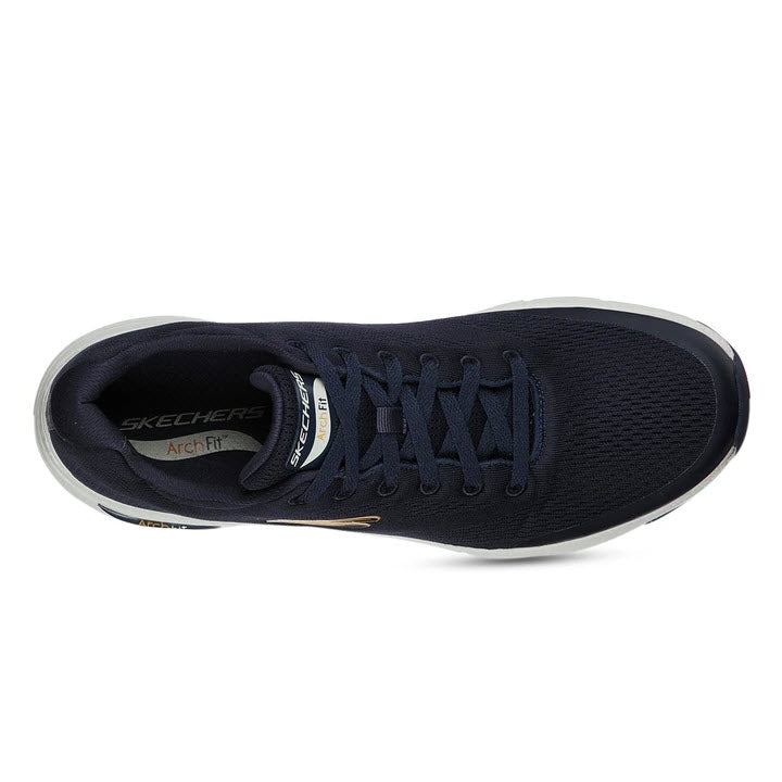 Top view of a single navy blue Skechers Arch Fit walking shoe with laces.
