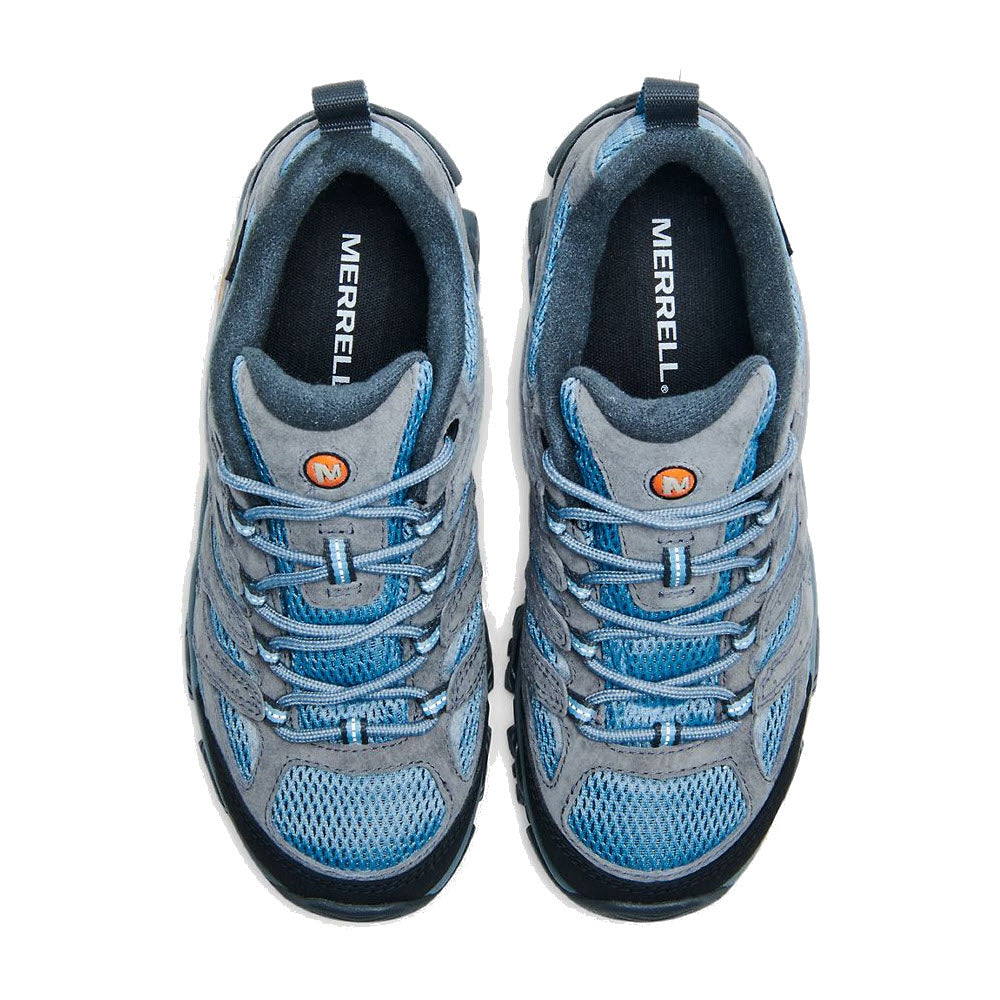 A pair of Merrell MERRELL MOAB 3 WATERPROOF ALTITUDE - WOMENS hiking shoes in blue and gray, viewed from above, showing the brand logo on the tongue and orange details.