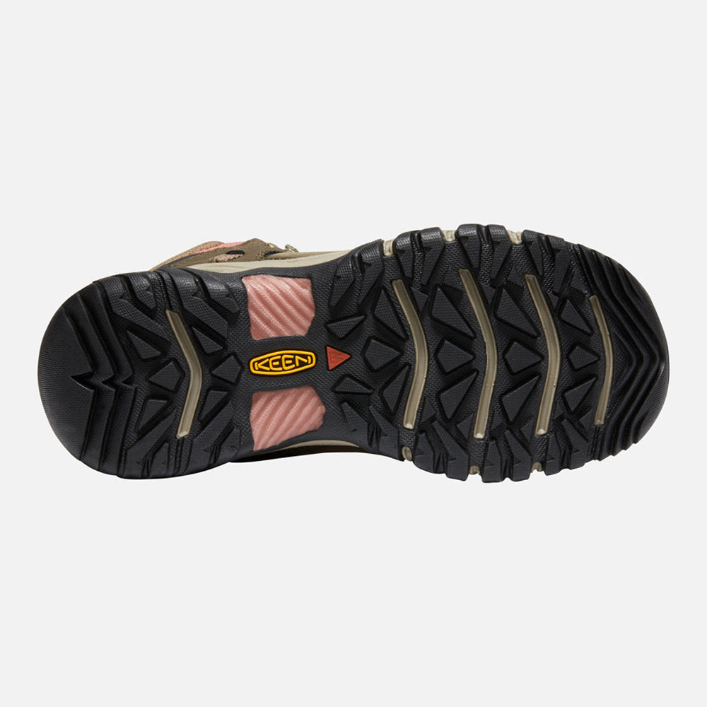 Bottom view of a Keen Ridge Flex Mid Waterproof Timberwolf/Brick Dust hiking boot with a detailed black and gray tread pattern, featuring red accents and a visible brand logo.