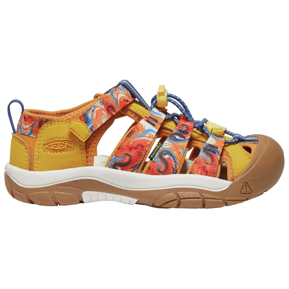 A colorful outdoor sandal with a rugged sole, yellow and orange patterned straps, blue-and-white laces, and covered toe, designed for durability and comfort.