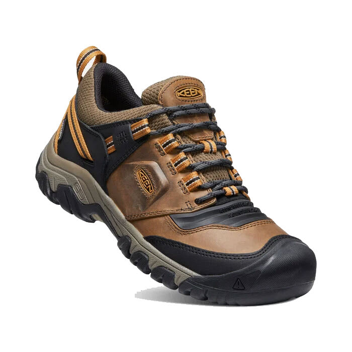 A single brown and black Keen Ridge Flex WP Bison waterproof hiking shoe with orange accents and a rugged sole, displayed on a white background.