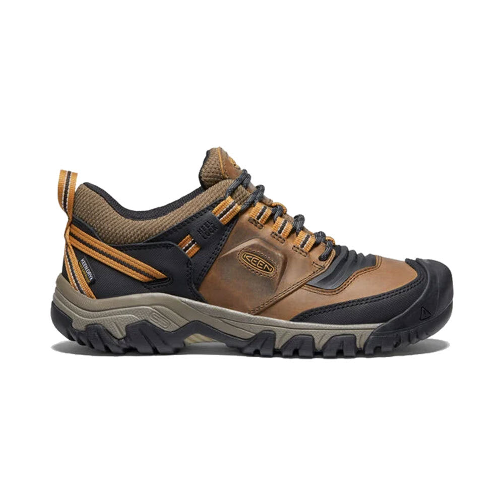 A single brown and black Keen Ridge Flex WP Bison hiking shoe with a rugged sole and orange accents, displayed against a white background.