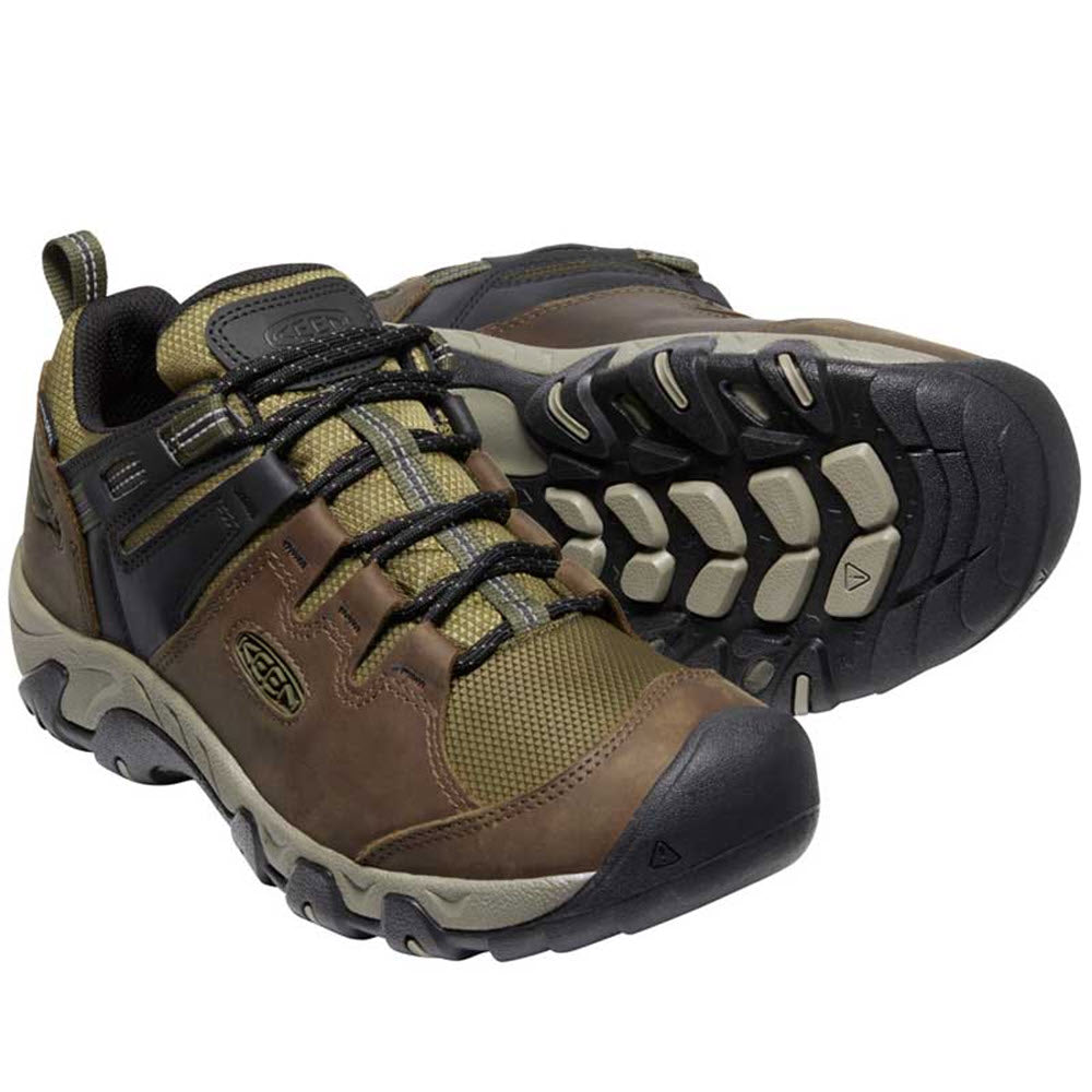 A pair of Keen hiking shoes with waterproof leather and mesh uppers, black and tan rubber soles, and laced fronts.