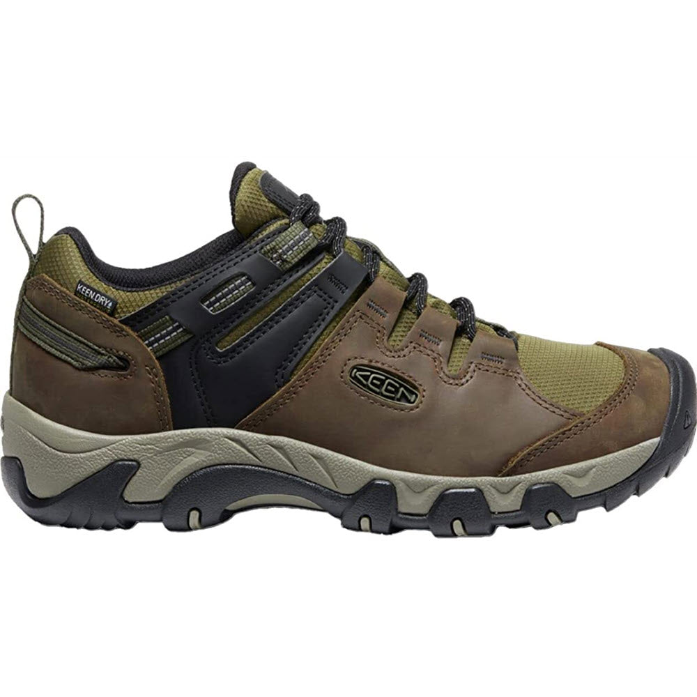 Brown and green Keen Steens waterproof leather hiking shoe with laces and a rugged sole.
