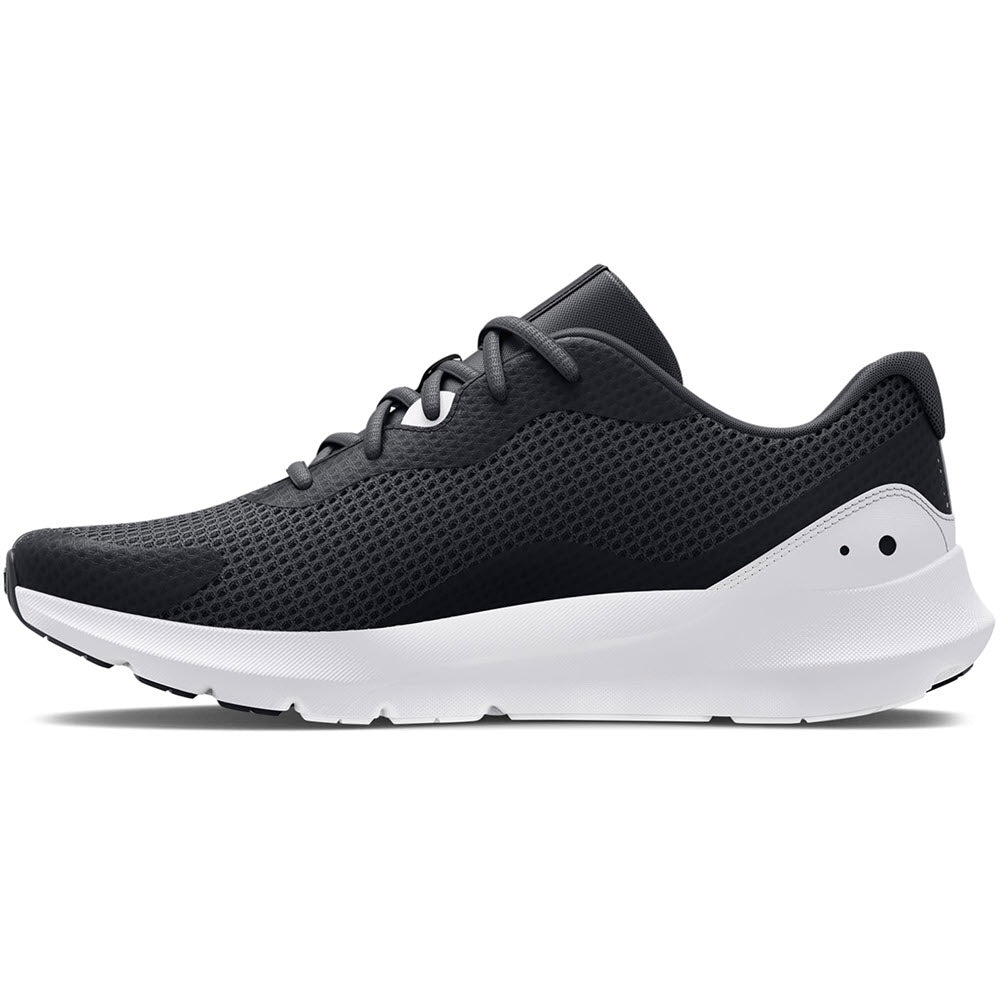 Side view of a black and white Under Armour Surge 3 running shoe with lace-up closure and a breathable mesh upper fabric.