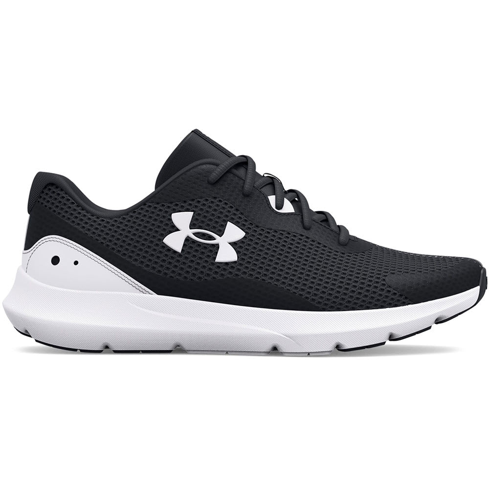 A black Under Armour Surge 3 running shoe with a cushioned white sole and logo on the side, isolated on a white background.