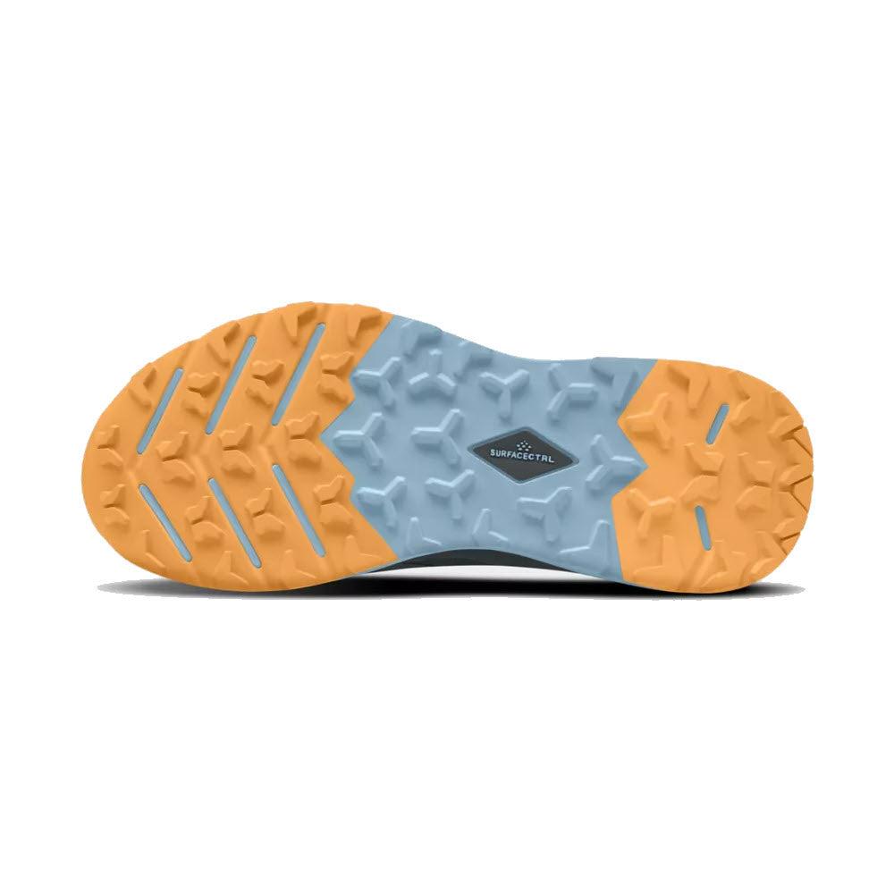 A close-up view of the underside of a North Face trail shoe showcasing a dual-tone, orange and light blue rubber sole with a hexagonal and line tread pattern.