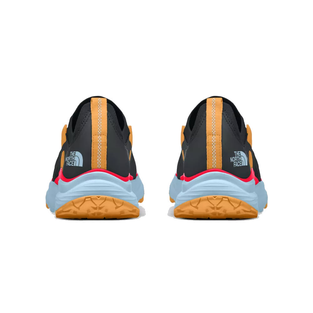 Rear view of two North Face VECTIV Hypnum Asphalt Grey/Brilliant Coral trail shoes, featuring black, orange, and blue detailing on a white background.