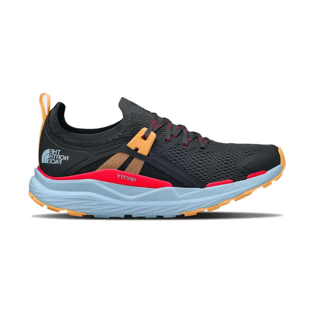 A modern trail shoe with a dark gray mesh upper, orange accents, and a light blue layered sole, displayed on a white background from North Face.