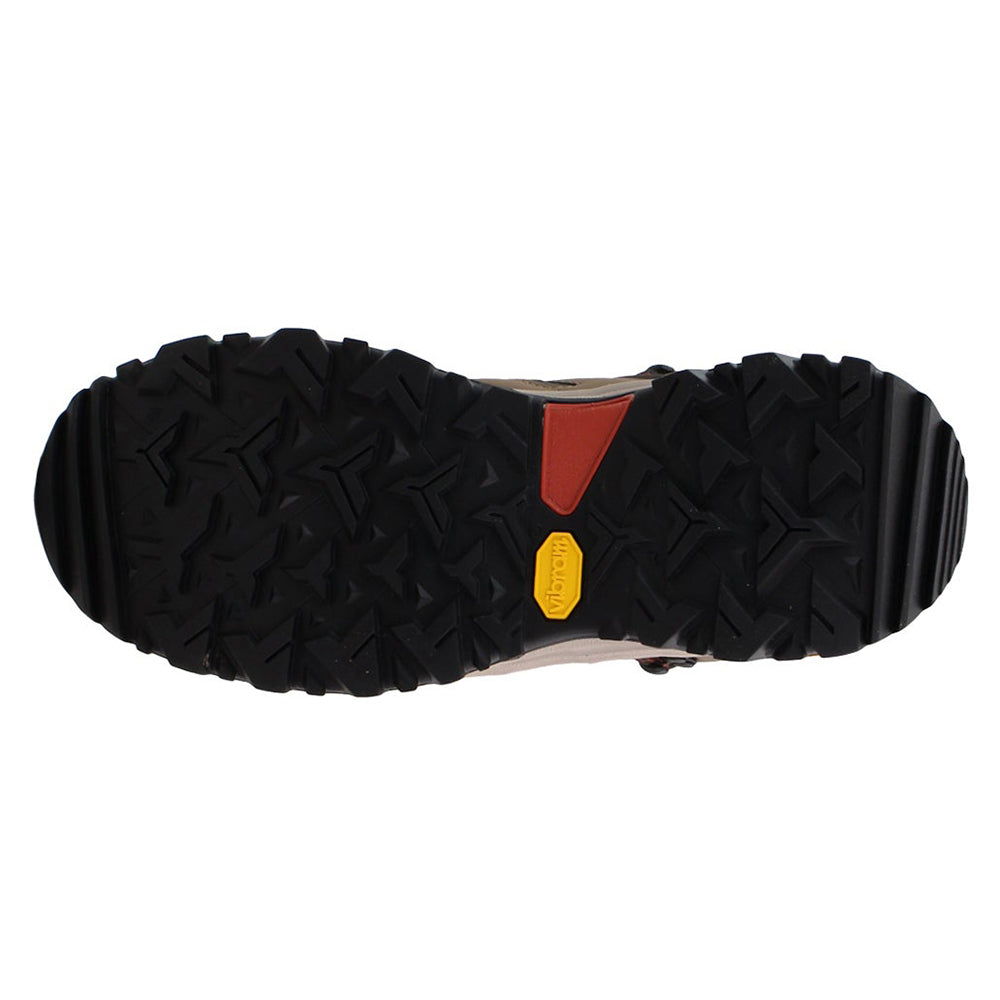 Bottom view of a North Face Hedgehog Fastpack II Mid WP Brown - Men&#39;s hiking boot sole showcasing a deep tread pattern with a red and yellow label.