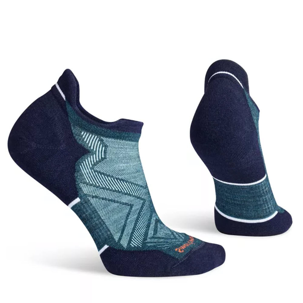 A pair of navy blue and teal Smartwool Run Targeted Cushion Low Ankle Socks displayed against a white background, featuring geometric patterns and crafted with Indestructawool™ technology.