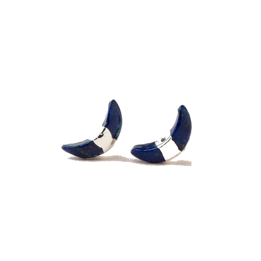 A pair of blue high-heeled shoes against a white background, complemented by Scout crescent moon earrings.