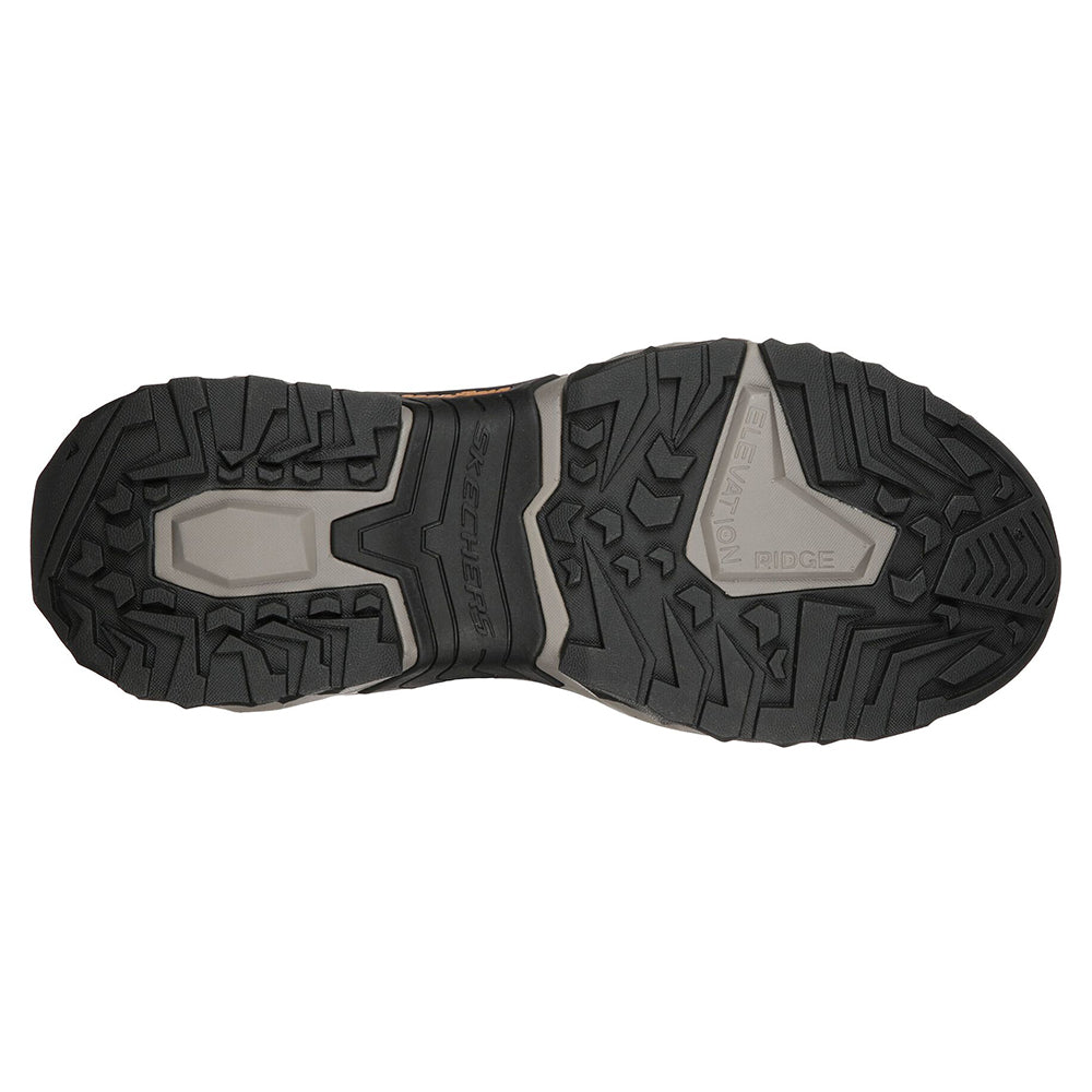 Tread pattern of a pair of Skechers Selvin Relaxed Fit Dark Brown - Mens hiking boots with a Goodyear Performance Outsole viewed from below.