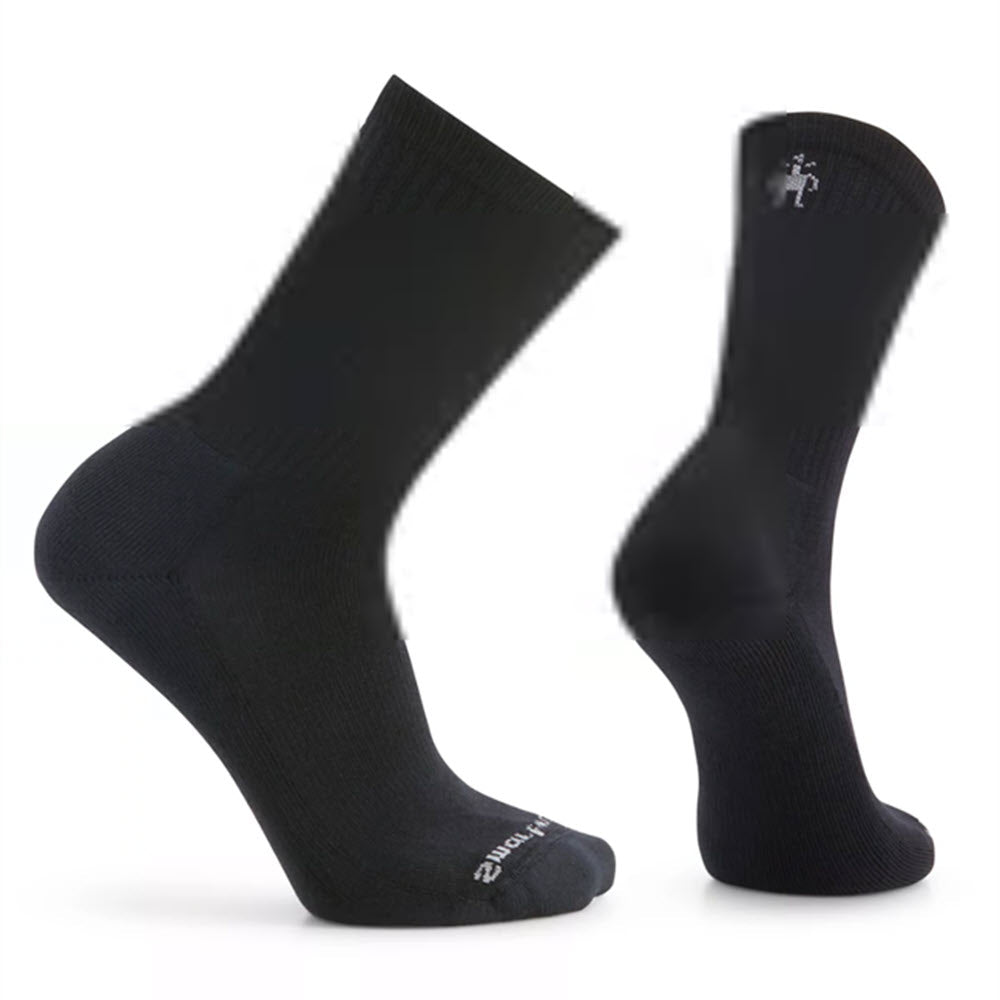A pair of black athletic Smartwool Solid Rib Crew Men's Black socks displayed against a white background, showing both the front and back views.