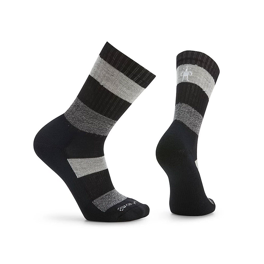 A pair of black and gray striped Smartwool Barnsley Crew socks displayed against a white background, one sock facing forward and the other showing the side.