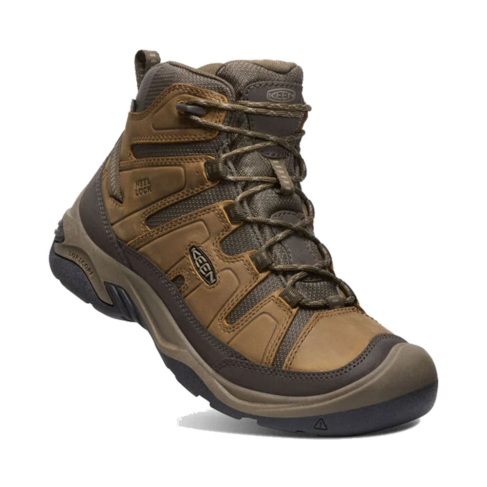 A single Keen Circadia Mid Waterproof Bison hiking boot with brown leather and grey accents, featuring a high-top design and laced front.