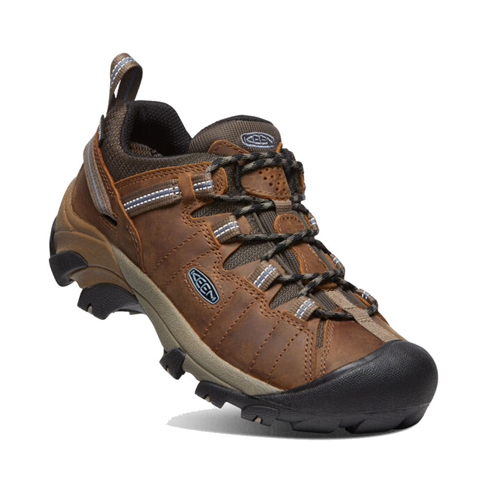 A single brown hiking shoe with black detailing, featuring a sturdy sole, Keen.Dry waterproof membrane, and lace-up front, isolated on a white background.