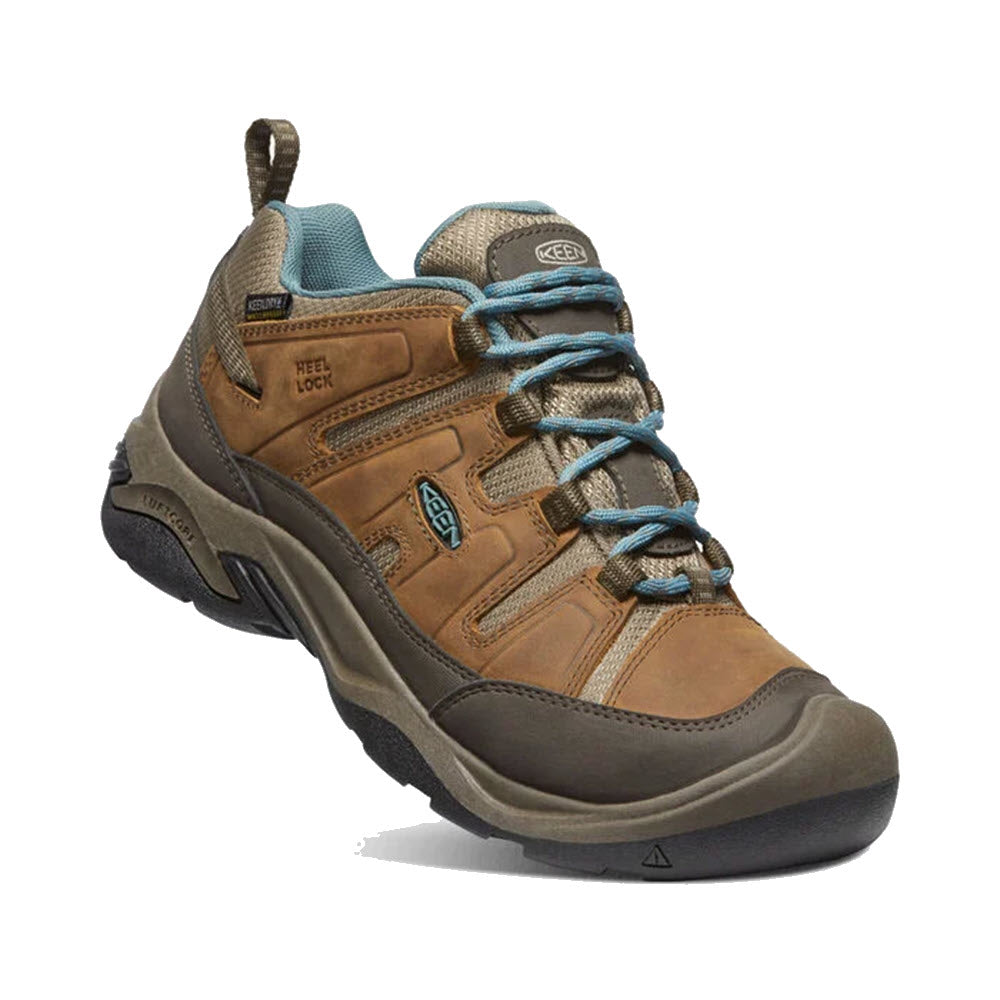 A single brown and teal KEEN CIRCADIA WP SYRUP waterproof hiking shoe with intricate lacing and labeled features such as &quot;heel lock&quot; on a white background.