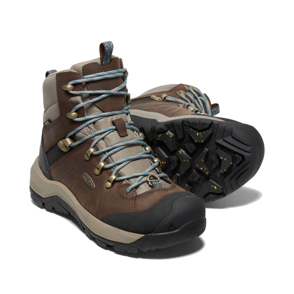 A pair of Keen Revel IV Mid Polar Coffee Bean hiking boots with blue-gray laces and a rugged, exceptional grip sole, displayed on a white background.