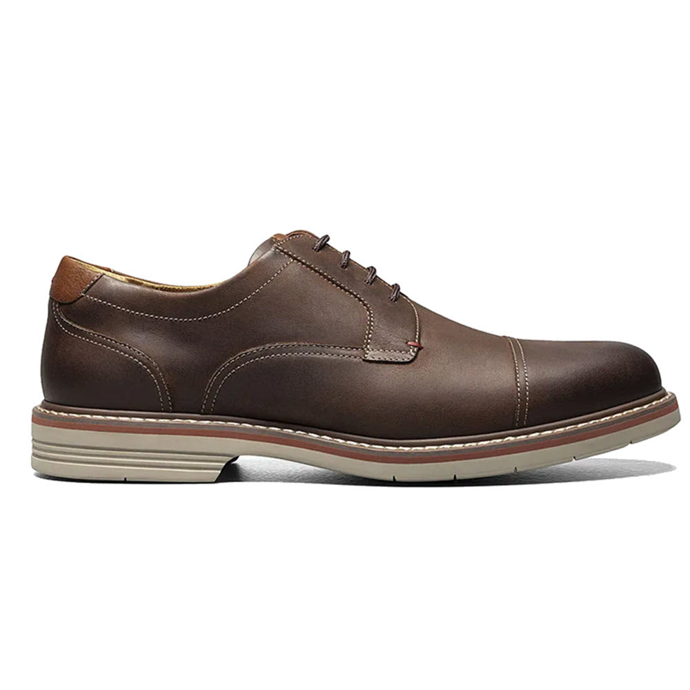 A brown leather Florsheim FLORSHEIM NORWALK CAP TOE OXFORD CRAZY HORSE BROWN - MENS dress shoe with contrasting sole stitching and a durable rubber sole.