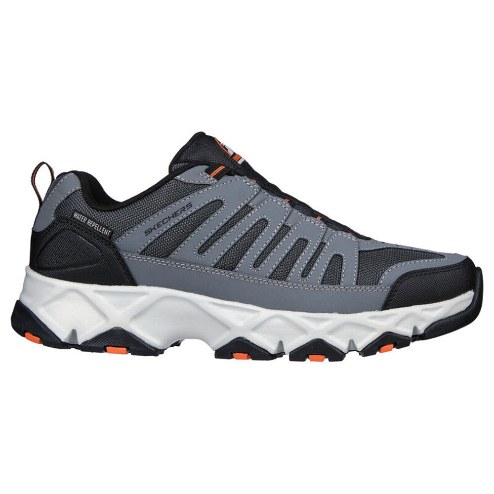 Gray and black Skechers CROSSBAR athletic shoe with Air-Cooled Memory Foam insole, white sole, and orange accents.